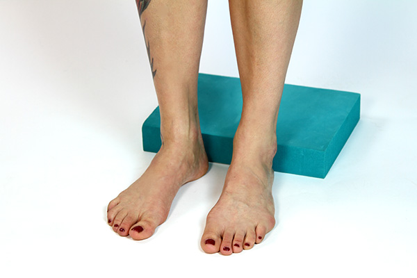 Foam blocks are a useful prop for seated exercises during Pilates mat classes